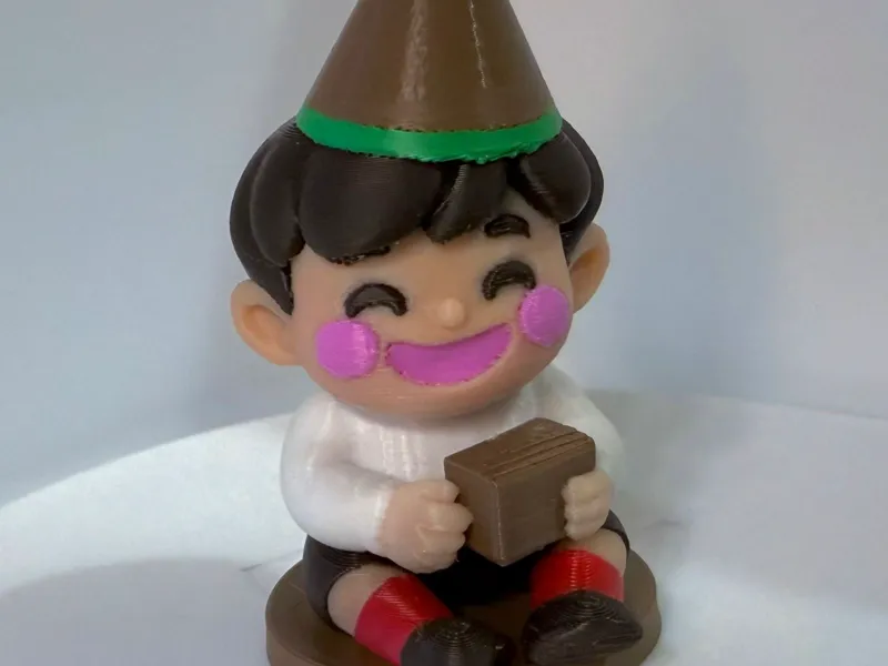 Miniatura 3D – Menino com Chapéu de Festa