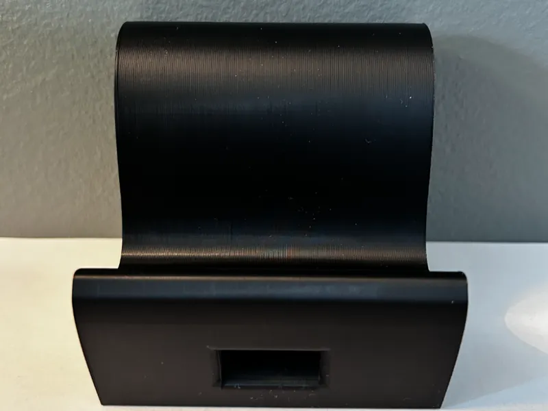 Phone holder with a hole for charger