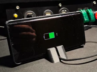 Smartphone stand with cable clip