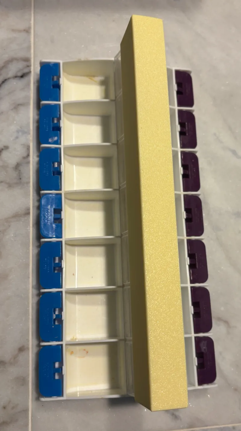 weekly pill box lid holder