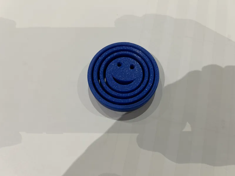 Smiley face gyroscope fidget
