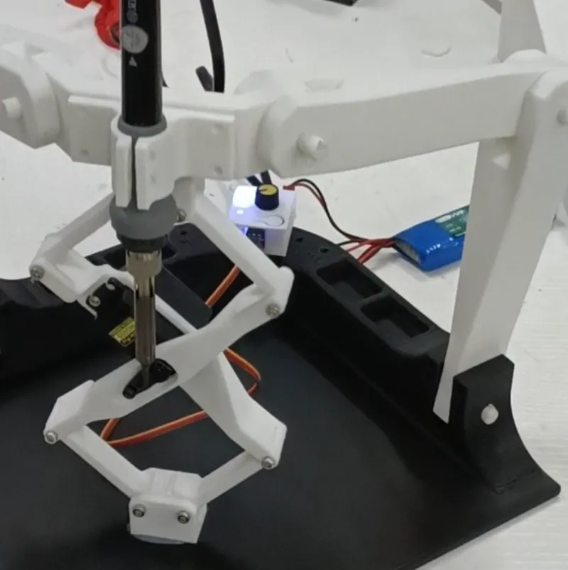 Electric hot-melt nut ironing device