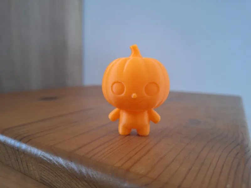 cute little pumpkin figure with a face