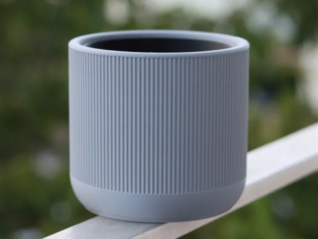 Self-watering plant pot with a narrow design