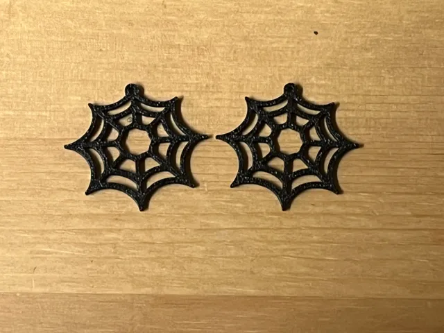 web earrings