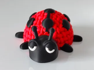 Articulated knitted ladybug