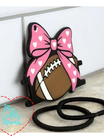 Accesorio para sujetar ligas de cabello: Football bow hair tie keychain — vista de referencia 2