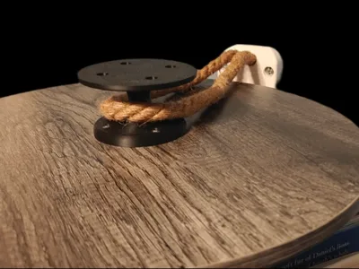 Rotating bookshelf wall anchor