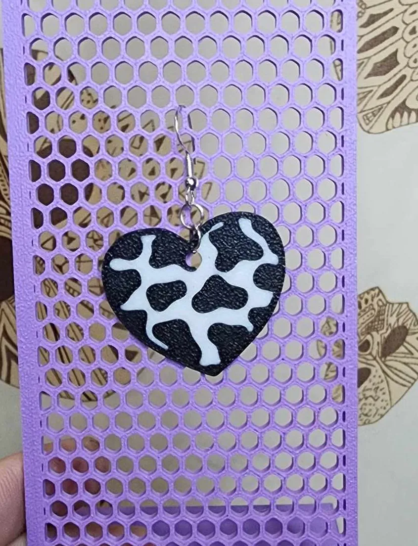 Cow print heart earrings view 3