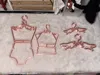 One of each of two styles of 1/4 size hangers, 0.2mm layer height, 3 walls, 20% infill