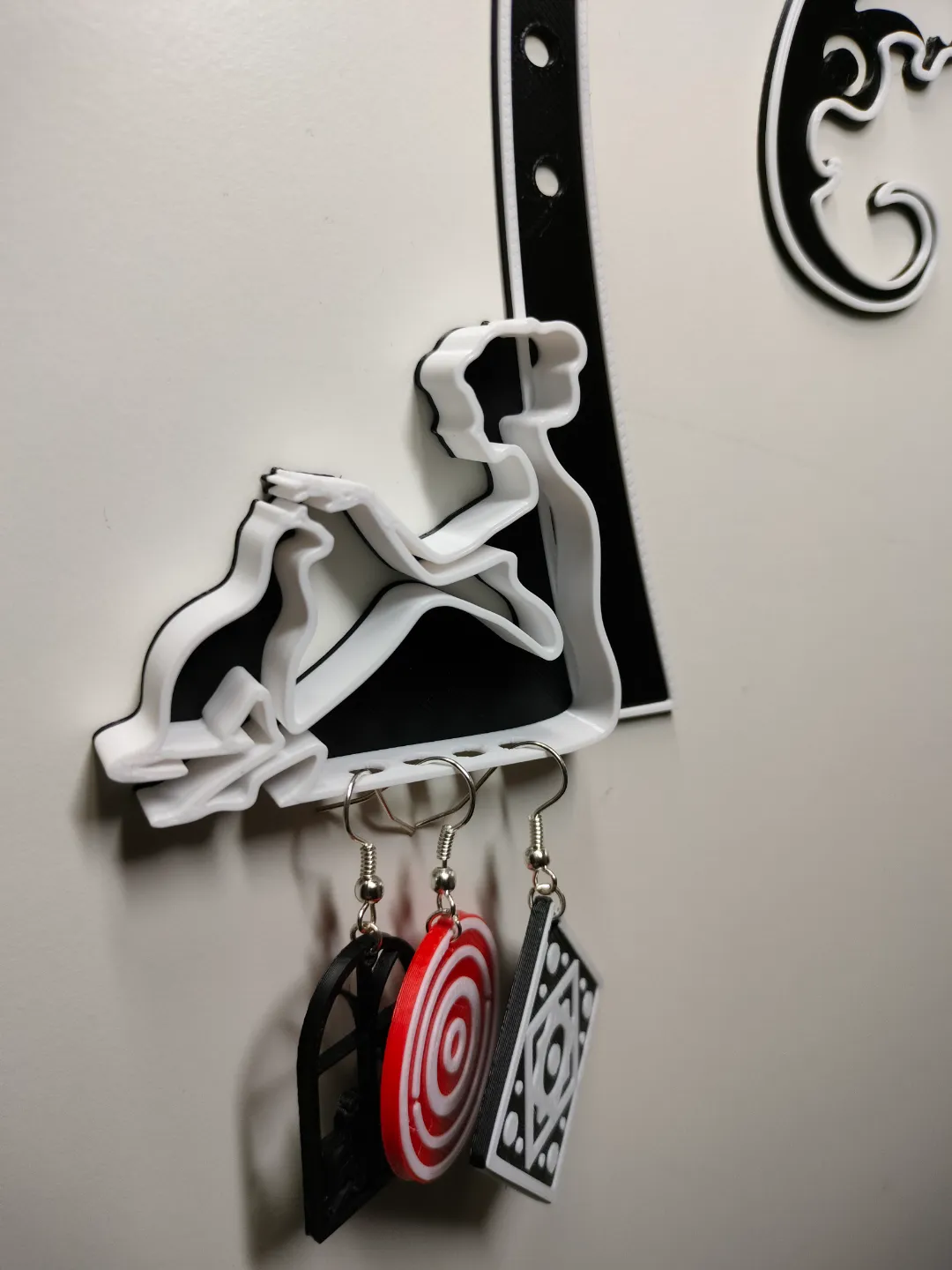 A hanger with a woman and a cat for earrings view 2