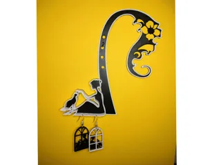 A hanger with a woman and a cat for earrings