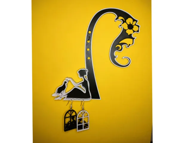 A hanger with a woman and a cat for earrings