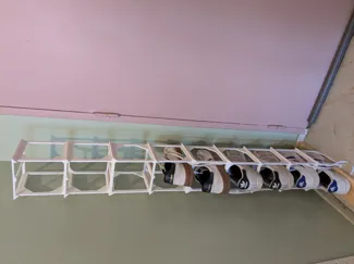 Compact thin vertical shoe holder
