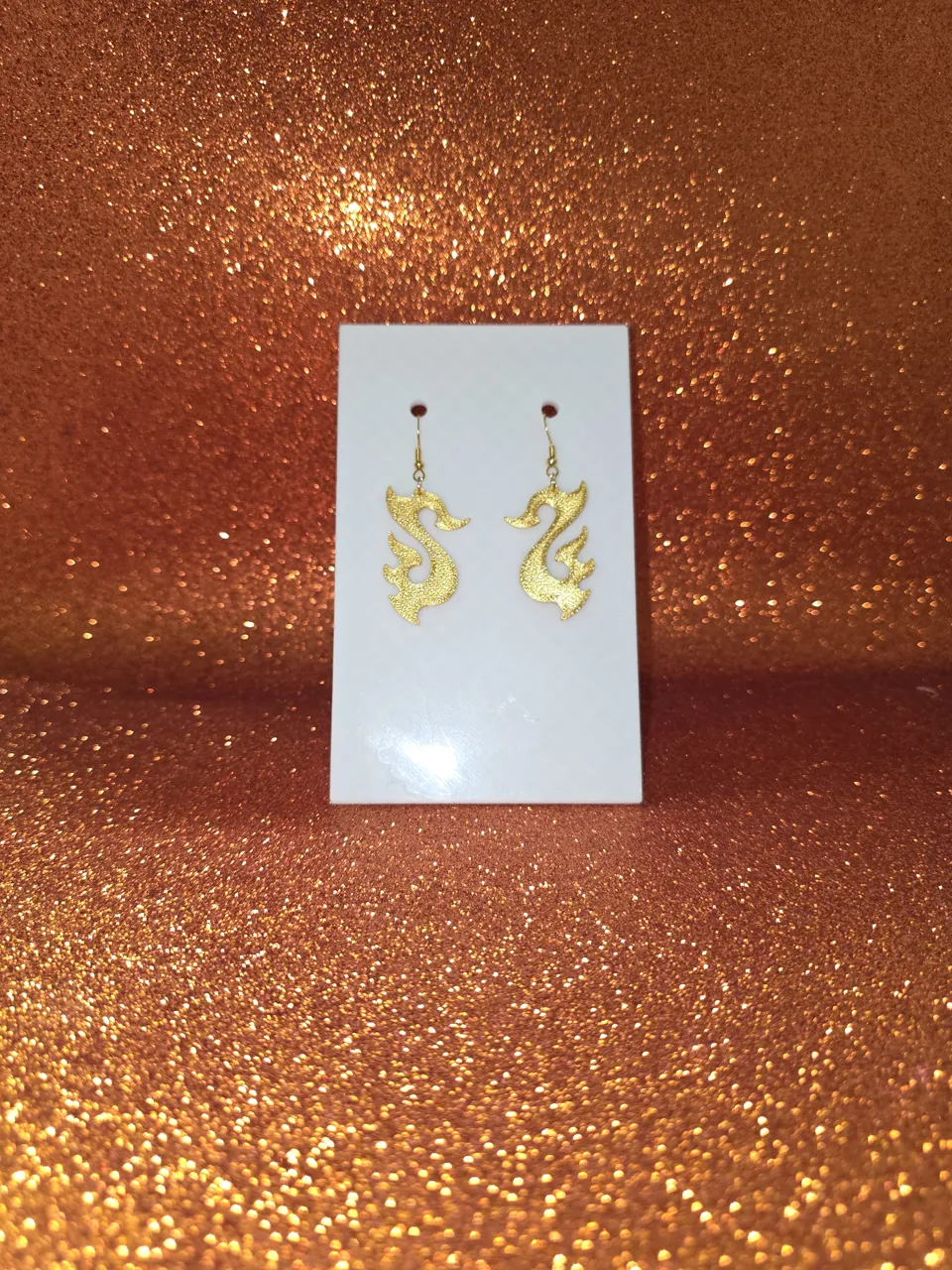 Flaming swan earrings view 2