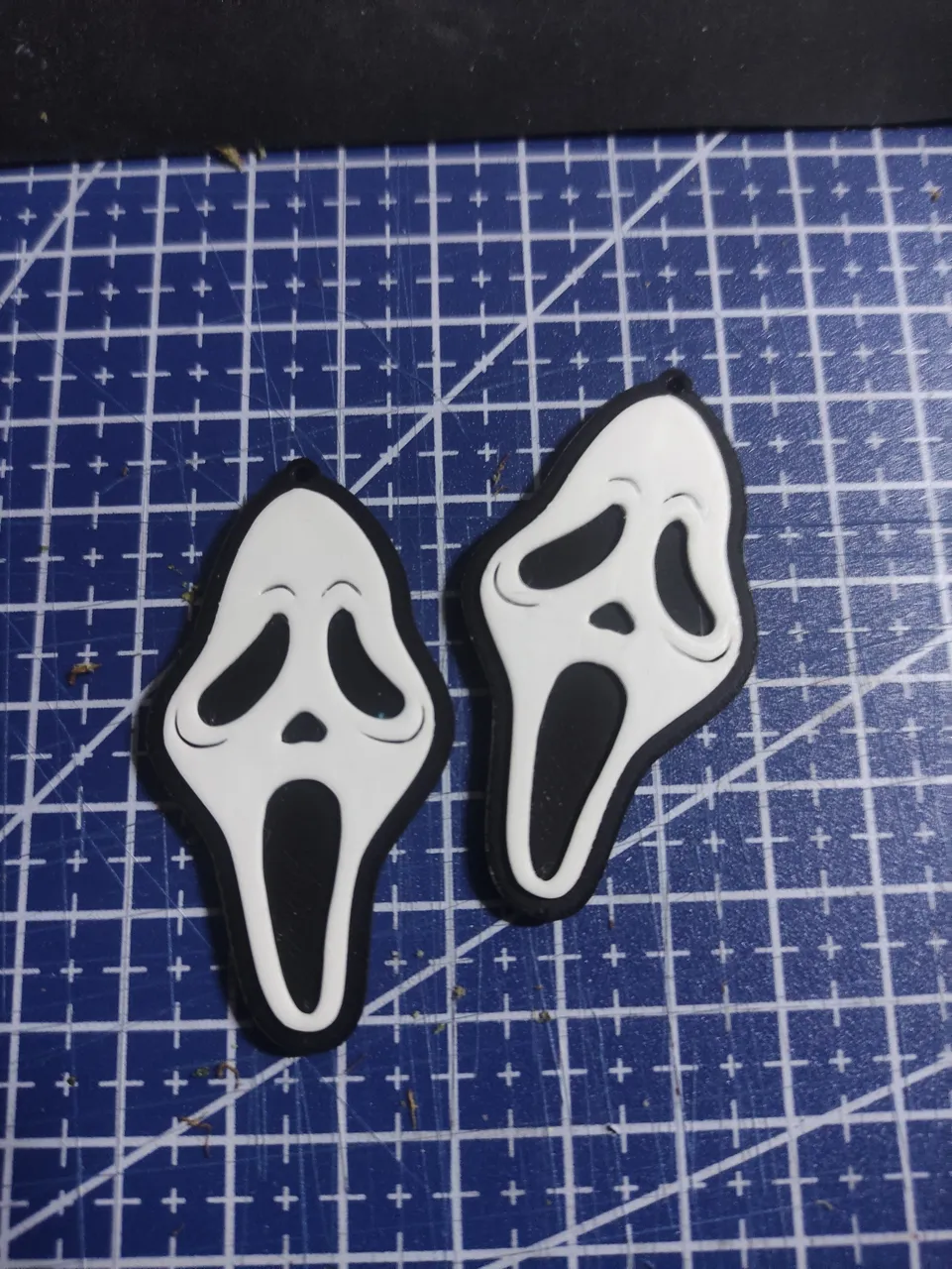 Ghost face earrings view 2