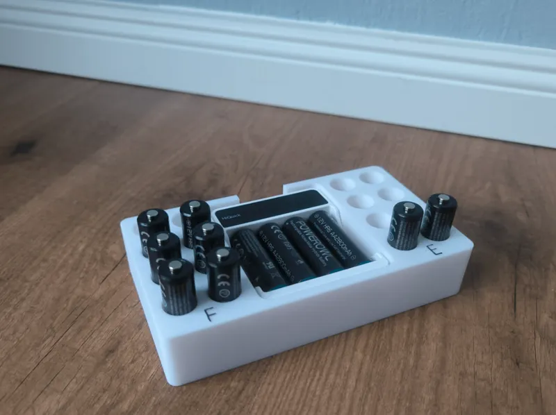 Battery and charger holder for AA batteries