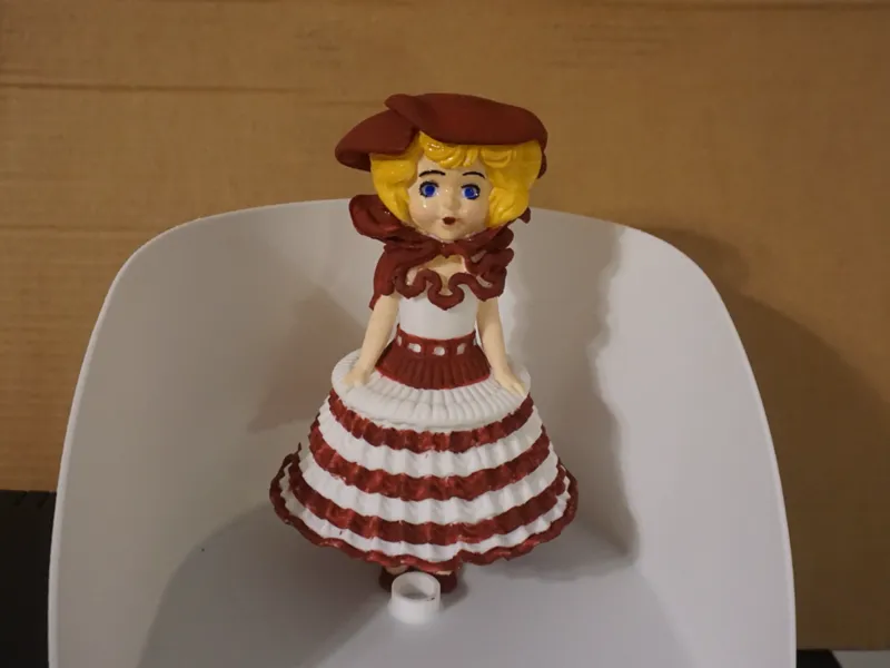 White and red hooped doll