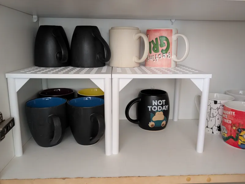 Shelf space saver - cup stand