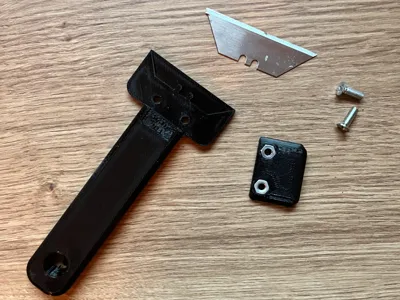 Scraper for utility blades