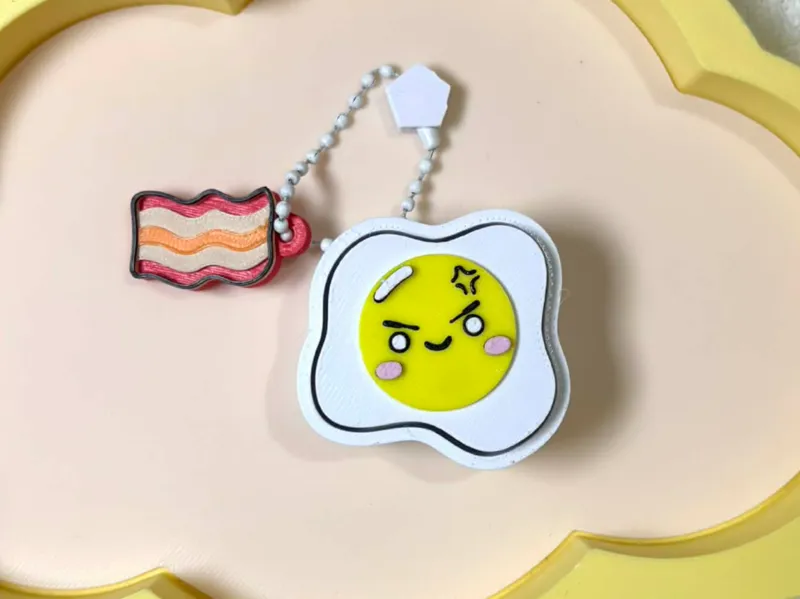Monday Egg Clicker Fidget with Bacon Charm