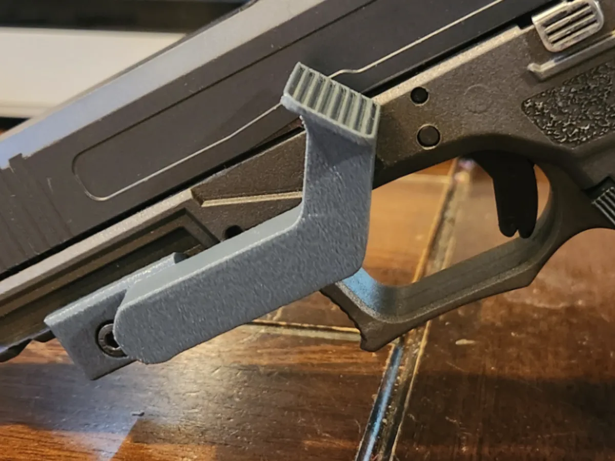 Repose-pouce pour pistolet