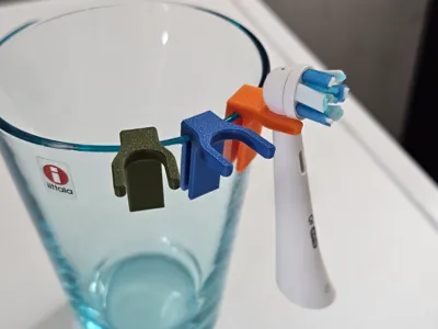 Oral-B brush head clip for toothbrush cup/holder