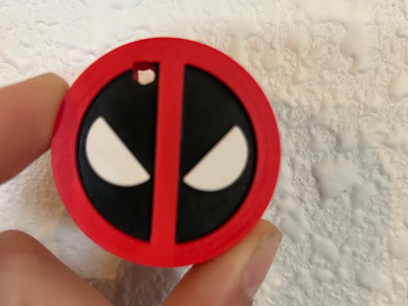 Deadpool logo with bullet hole