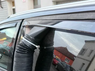Diesel heater outlet to a car window.