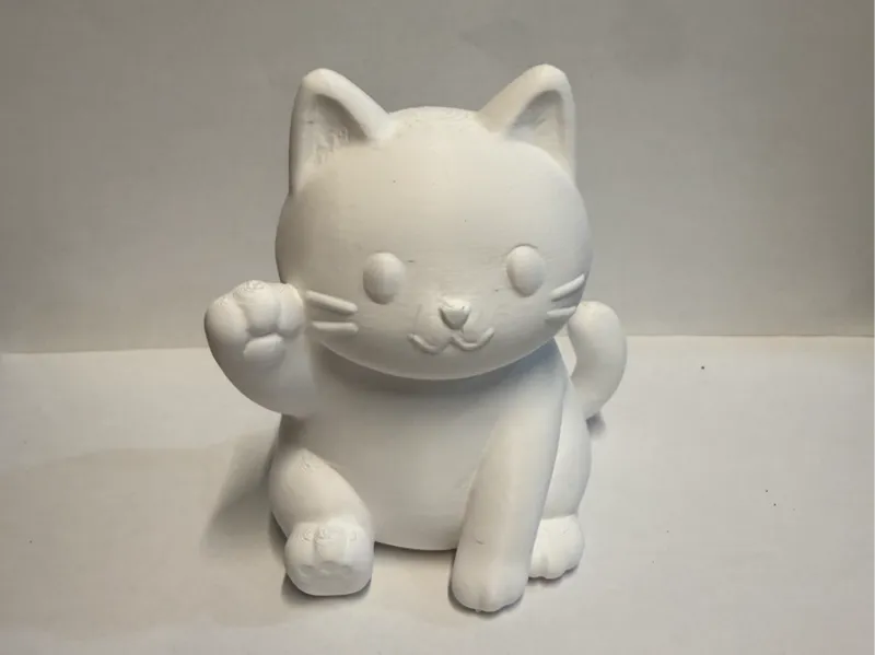 Tiny waving Cat Figurine