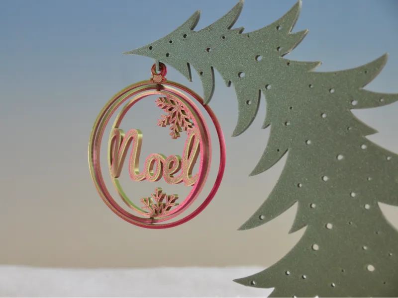 Christmas spinning ornament Noel