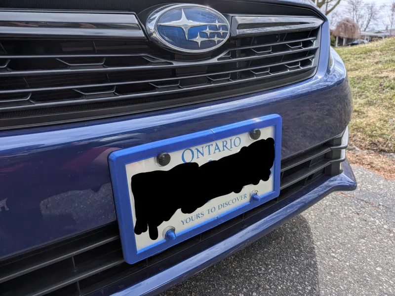 License plate frame for clear plate covers