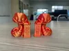 A pair, variable layer height, manual supports enabled, 2 walls, 15% infill