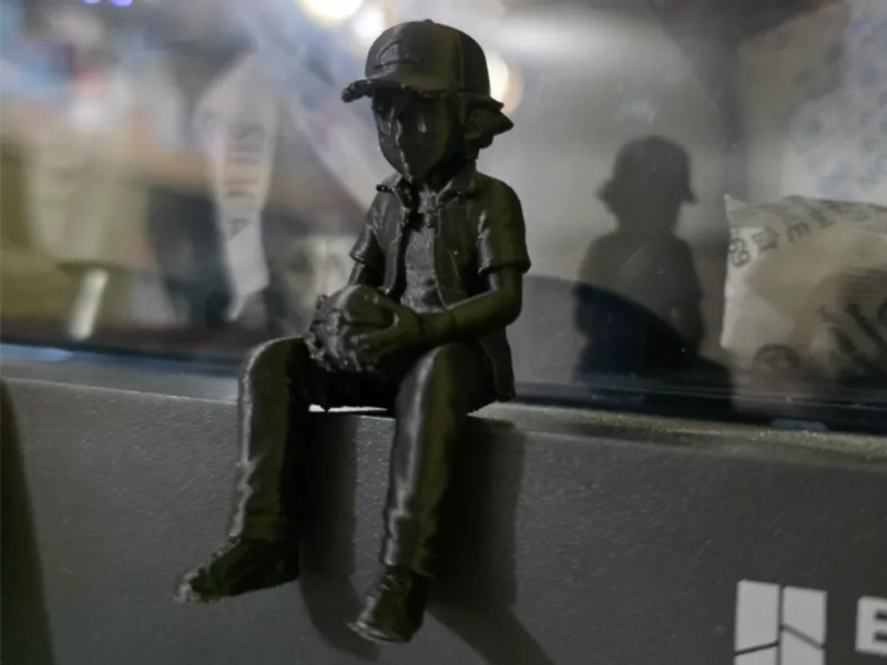 ash ketchum sitting on ledge