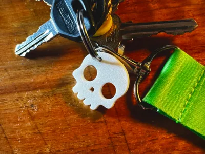 Bullet Hole Skull Keychain