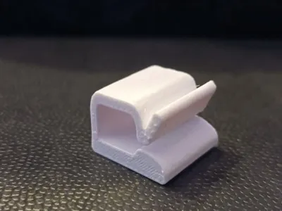 Spring cable clip with double-sided adhesive fixing