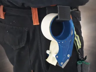 DISPENSER TAPE HOLDER