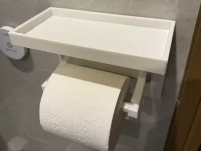 Phone holder designed to fit a 100mm wide toilet paper roll holder