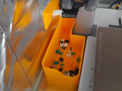 A1 waste bucket and deflector
