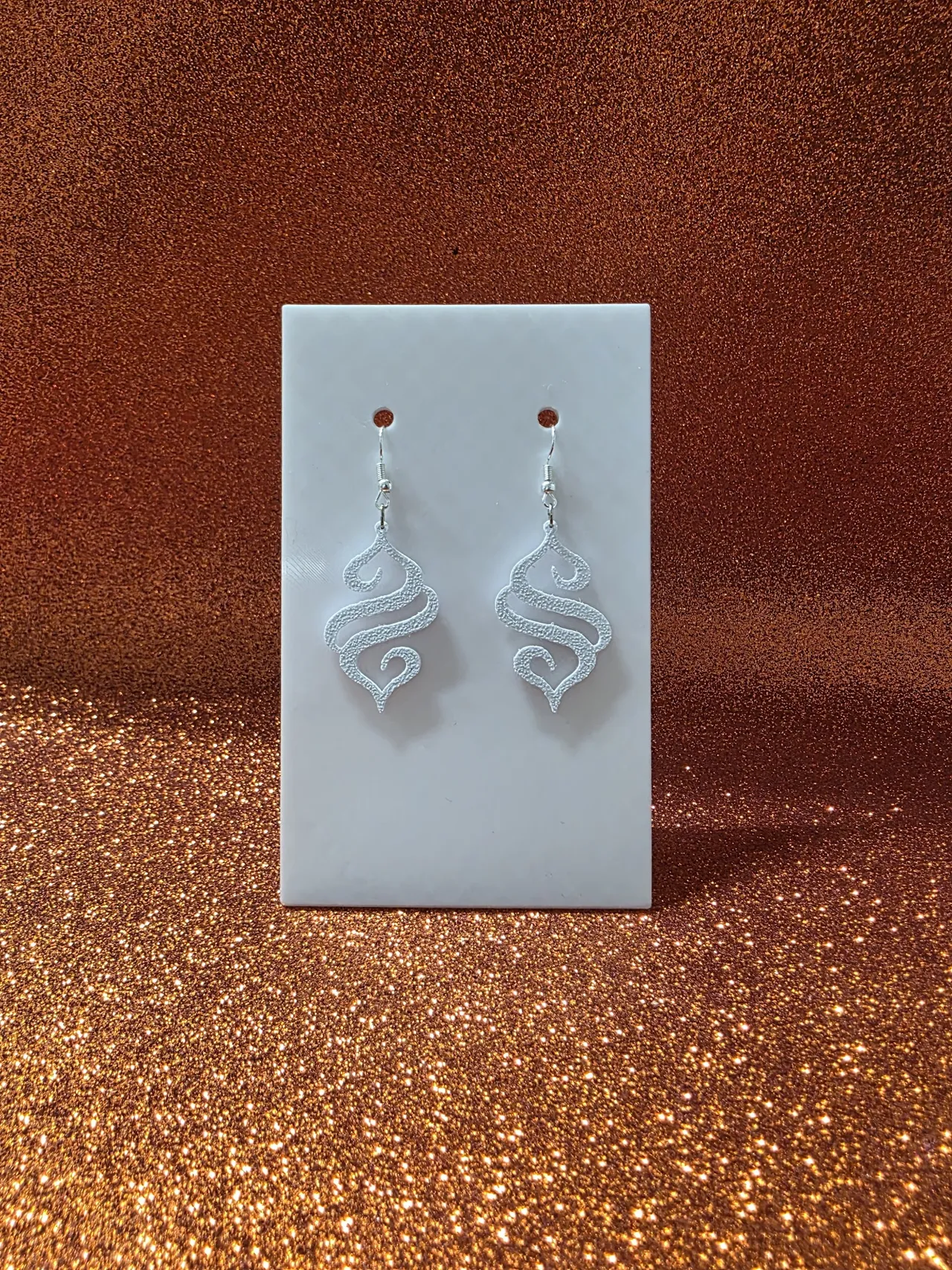 Calligraphic flame silhouette earrings view 2