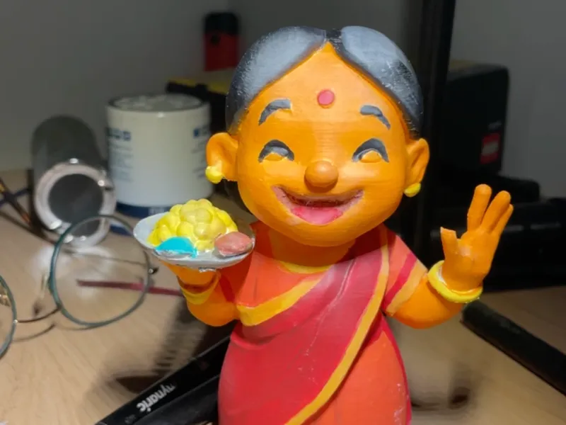 Traditional Indian Mother holding a plate of food