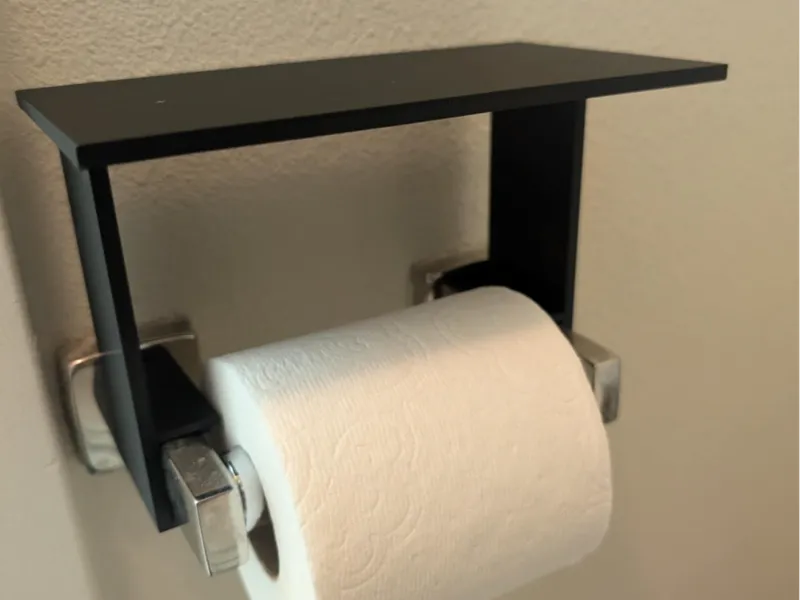 Phone Shelf attachment to toilet paper roll holder
