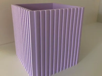 Square planter pot with verticle lines.