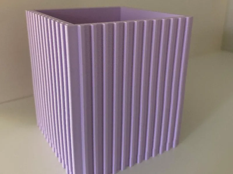 Square planter pot with verticle lines.
