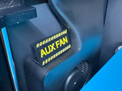 Aux Fan caution sign
