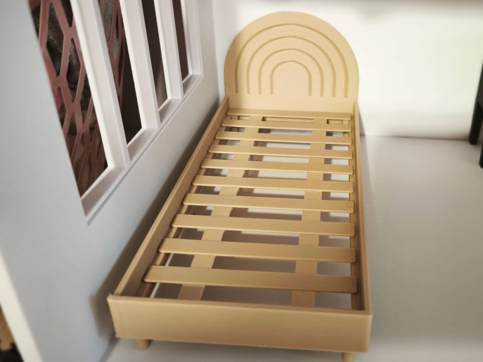 Miniature bed for dolls
