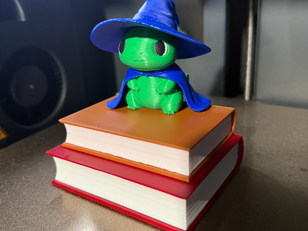 cute wizard dino sitting on books