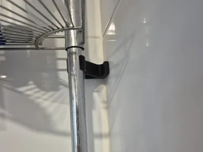 Shower rack stabilizer