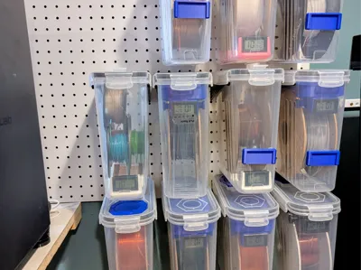 Pegboard filament container holder