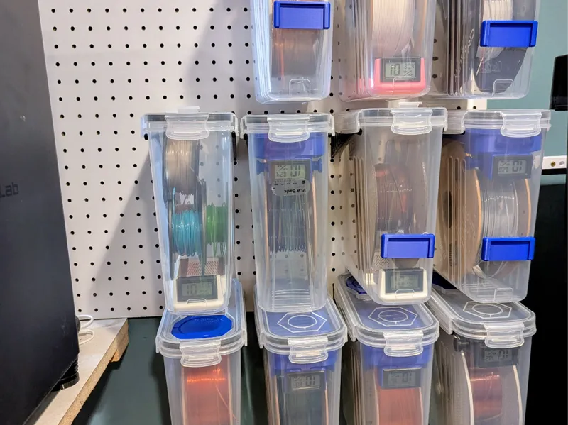 Pegboard filament container holder
